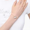 Das Knopfkettenarmband Das Knopfkettenarmband