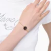 Das Knopfkettenarmband Das Knopfkettenarmband