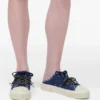 Der Puffy Daisy Denim Sneaker Mule