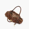 Die kleine Cristina-Tasche aus Wildleder Die kleine Cristina-Tasche aus Wildleder