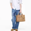 The medium-sized Canvas Tote Bag with Trompe-l’œil charm