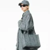 The medium-sized Washed Monogram Denim Tote Bag The medium-sized Washed Monogram Denim Tote Bag