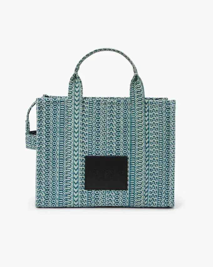 The medium-sized Washed Monogram Denim Tote Bag The medium-sized Washed Monogram Denim Tote Bag